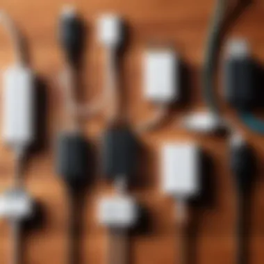 Different Types of Phone Chargers An assortment of phone chargers and cables on a wooden surface